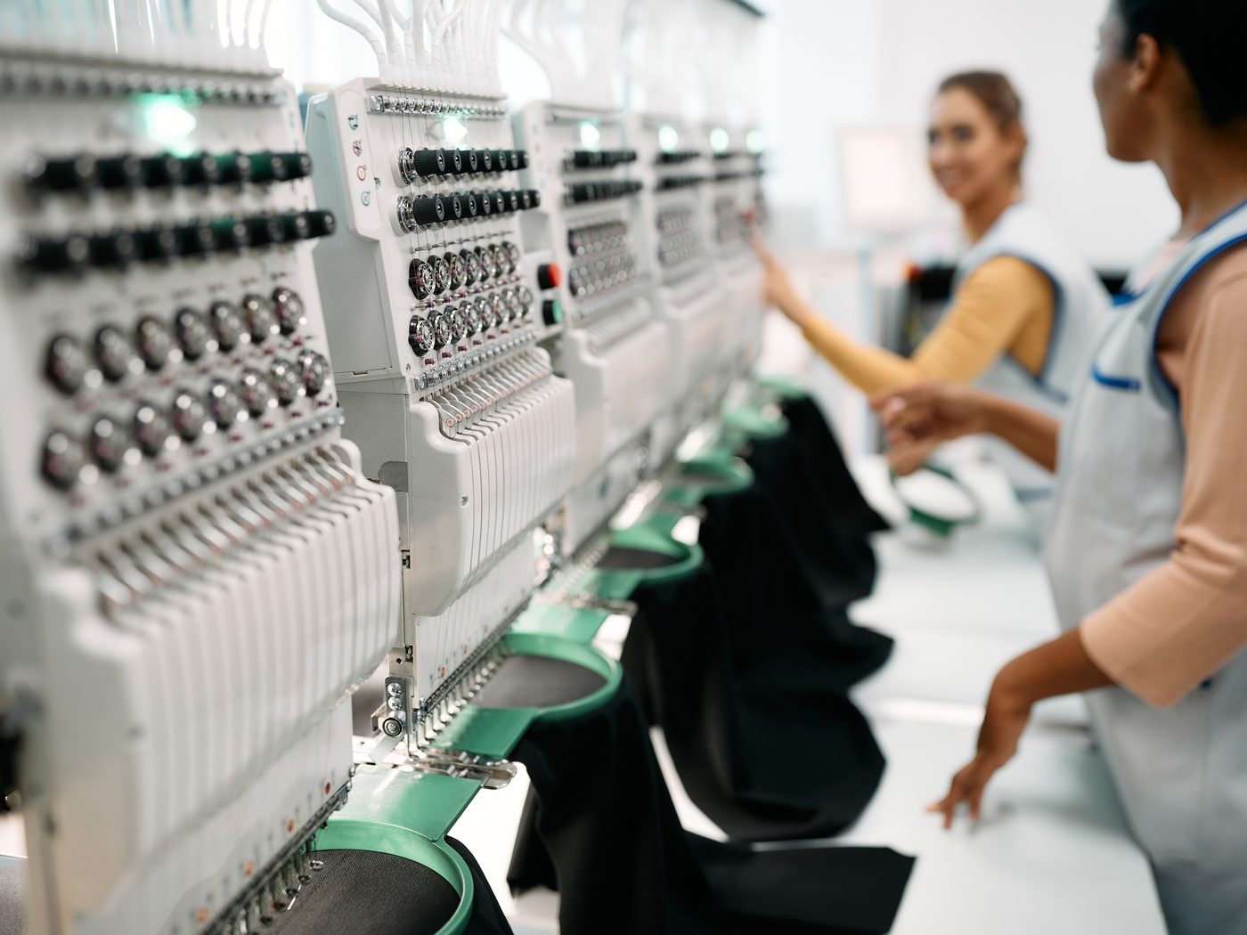 Industrial embroidery machines running on Icon's production floor