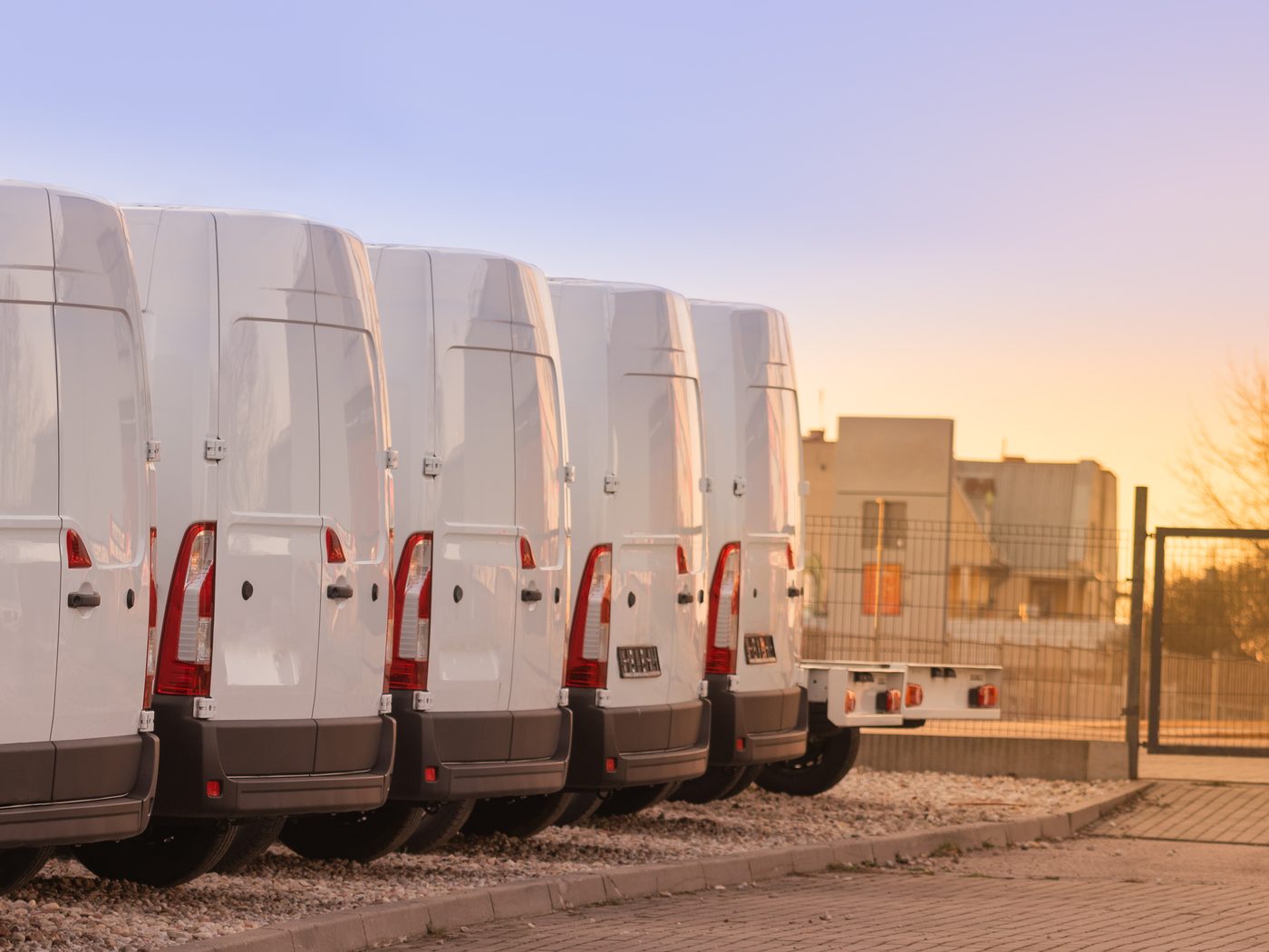 A row of commercial vans waiting to be branded