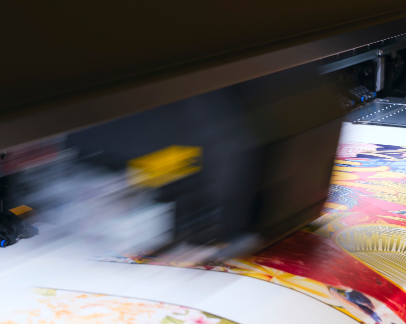 A wide format printer producing large scale signage graphics